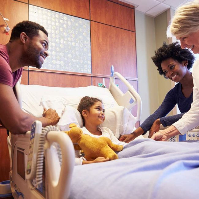 Doctor with child and family