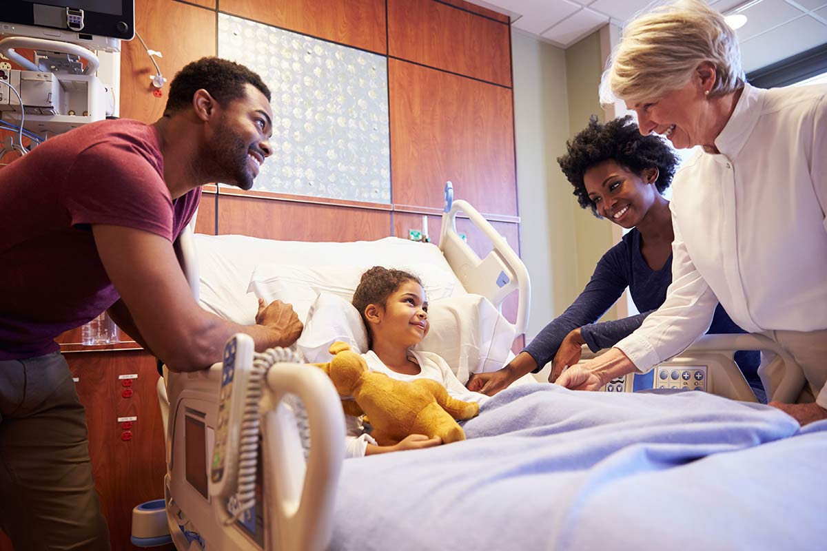 Doctor with child and family